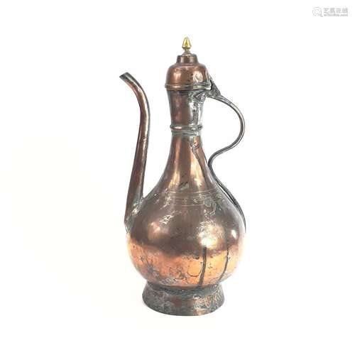 An Islamic tinned copper ewer, 19th century, height 37.5cm, ...