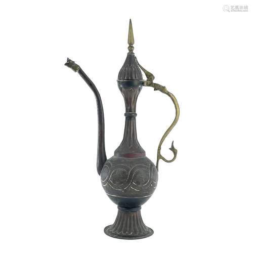 An Islamic copper ewer, 19th century, height 44cm, width 24c...