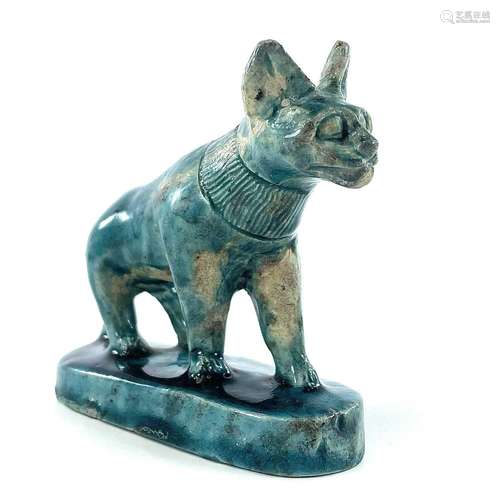 An Egyptian glazed faience pottery model of a cat, possibly ...