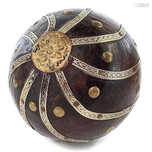 An Indian wooden ball, early 20th century, applied with whit...