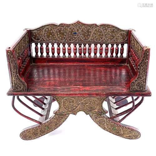 An Indian Howdah chair, with a spindle filled back on a soli...