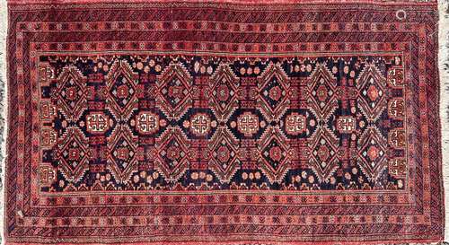 An Afghan rug, circa 1920-1930, the indigo field with seven ...