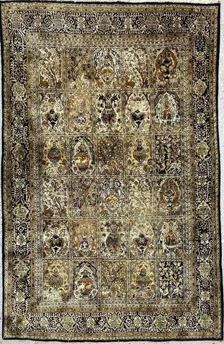 A Qum silk rug, Central Persia, circa 1950-1960, with six ro...