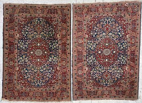 A pair of Tabriz rugs, North West Persia, the indigo field w...