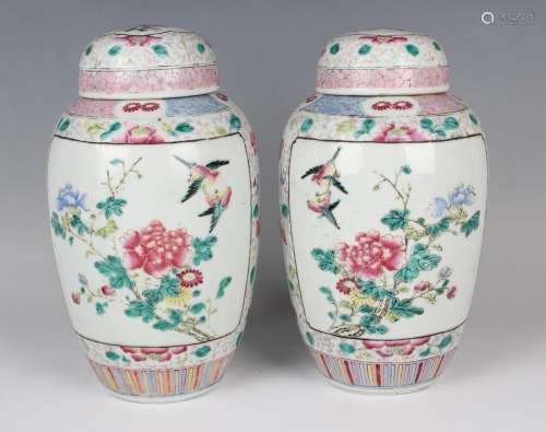 A pair of Chinese famille rose porcelain jars and domed cove...