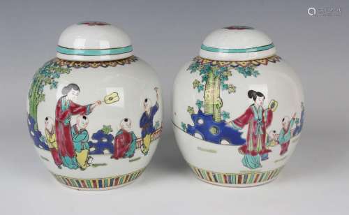 A pair of Chinese famille rose porcelain ginger jars and cov...