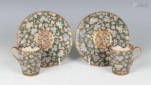 A pair of Japanese Satsuma earthenware cups and saucers by R...