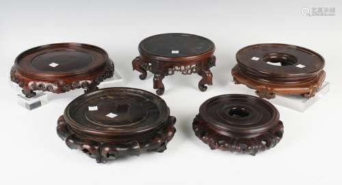 A collection of eleven Chinese hardwood stands