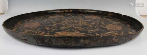 A Chinese lacquer circular tray