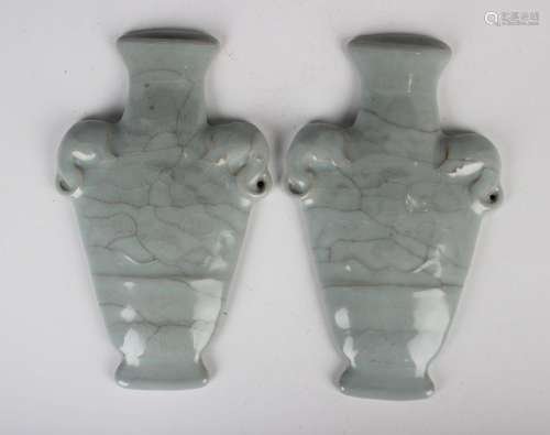 A pair of Chinese pale blue glazed brown stoneware wall plaq...