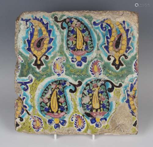A Persian tin glazed earthenware tile