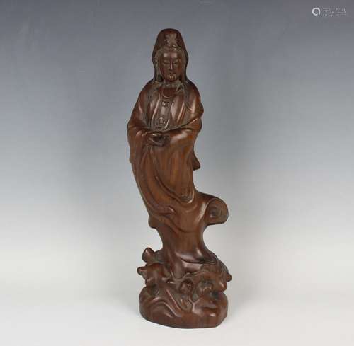 A Chinese carved hardwood figure of Guanyin