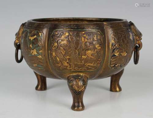 A Chinese bronze tripod censer with gilt and cold