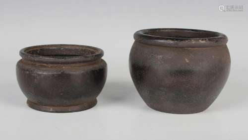 Two Chinese brown patinated bronze bowls