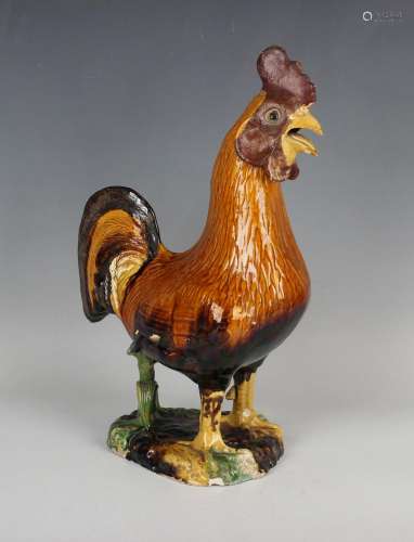 A Chinese sancai glazed pottery figure of a cockerel