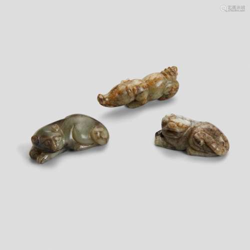 THREE GRAY AND BEIGE JADE FIGURES OF ANIMALS Late Qing dynas...