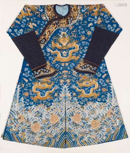 A BLUE-GROUND EMBROIDERED SILK 'DRAGON' ROBE Late Qi...