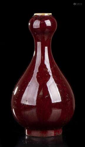 A FLAMBE GLAZED PORCELAIN BOTTLE VASE
China, 20th century