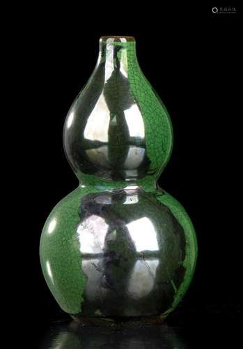 A GREEN GLAZED PORCELAIN DOUBLE GOURD VASE
China, 20th centu...