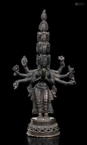 AN EIGHT-ARMED AND TEN-HEADED BRONZE AVALOKITESVARA
Tibet, e...