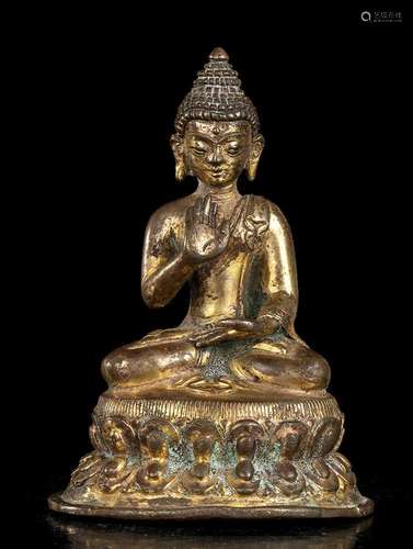 A GILT BRONZE BUDDHA
Tibet, 17th-18th century