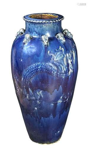 A LARGE BLUE GLAZED MARTABAN CERAMIC 'DRAGON' JAR
Southern C...