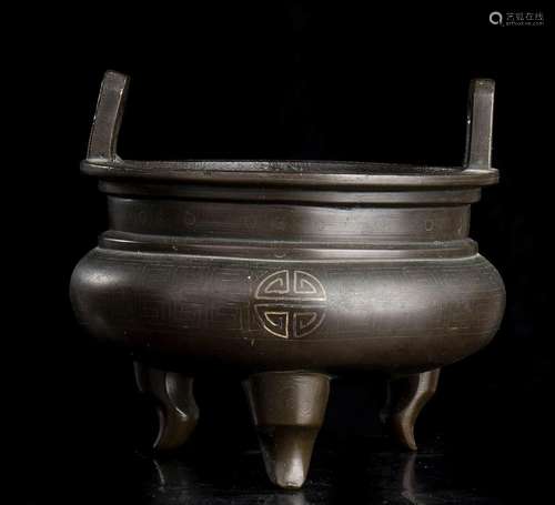 A BRONZE TRIPOD INCENSE BURNER
China, Qing dynasty