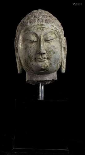 A LARGE STONE BUDDHA HEAD
China, 20th century