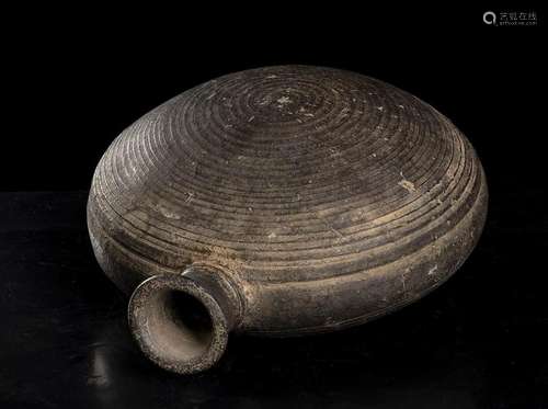 A BLACK STONEWARE COMPRESSED GLOBULAR FLASK
Korea, Goryeo dy...