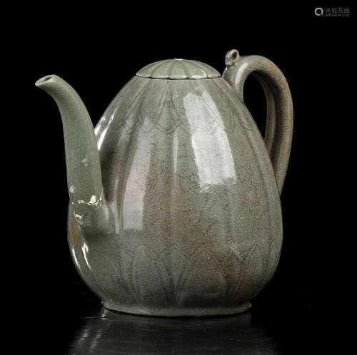 AN INCISED AND CÉLADON GLAZED CERAMIC EWER AND COVER
Korea, ...