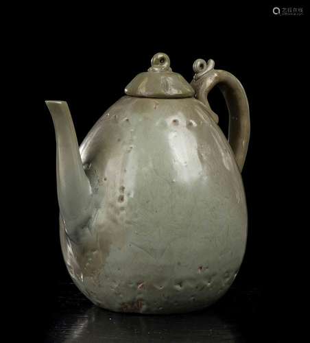 AN INCISED AND CÉLADON GLAZED CERAMIC EWER
Korea, Goryeo per...