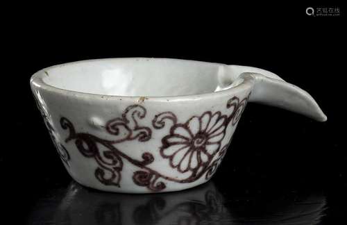 A WHITE GLAZED AND COPPER RED DECORATED PORCELAIN  SPOUTED B...