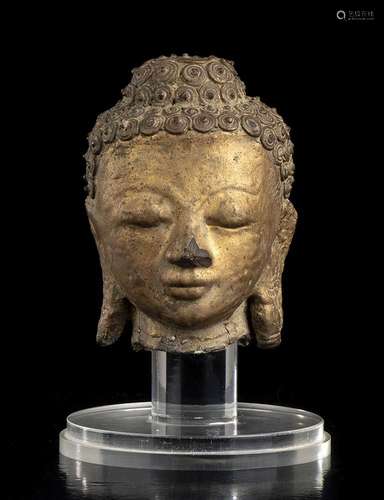 A GILT DRY LACQUER BUDDHA HEAD
Burma, 19th century