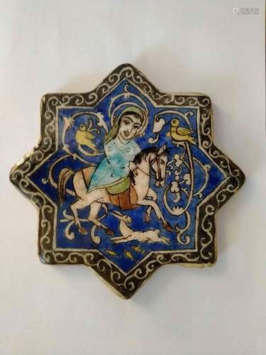 A GLAZED AND ENAMELLED CERAMIC TILE
Persia, Qajar, 19th cent...