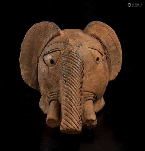 A POTTERY ELEPHANT HEAD  
Africa, Nok style