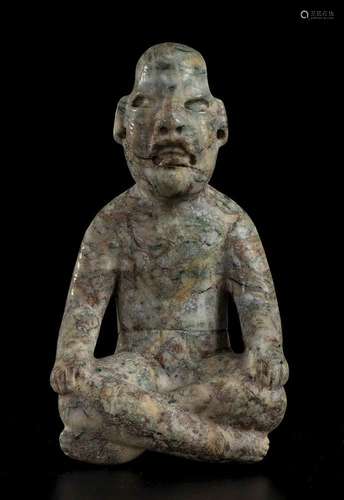 A STONE SITTING FIGURE
Olmec style