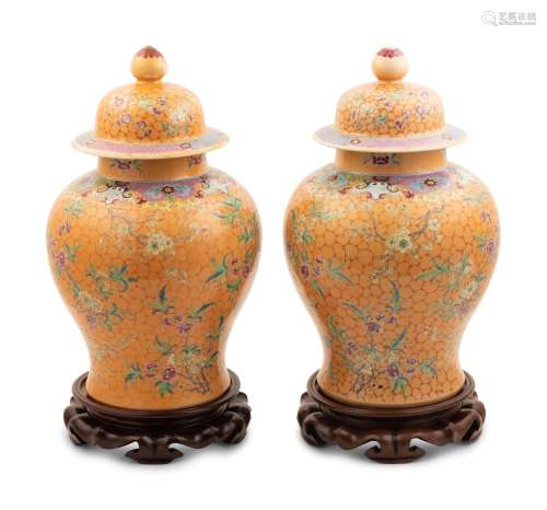 A Pair of Chinese Ochre Ground Famille Rose Porcelain Covere...