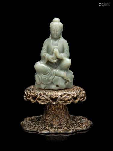 A Chinese Celadon Jade Figure of Seated Guanyin
