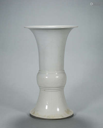 A banana leaf and flower carved white glazed porcelain beake...