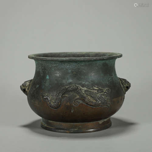 A dragon and phoenix patterned copper censer with beast shap...