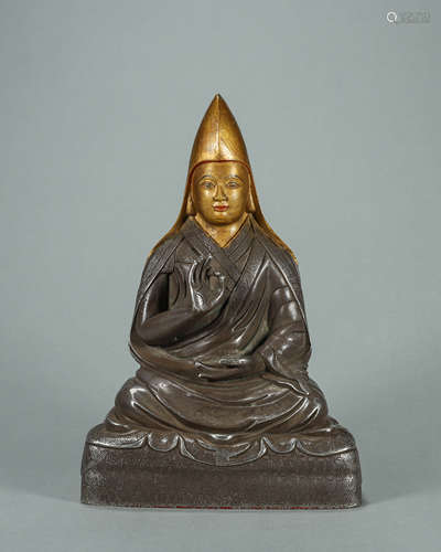 A silver Tibetan buddha statue