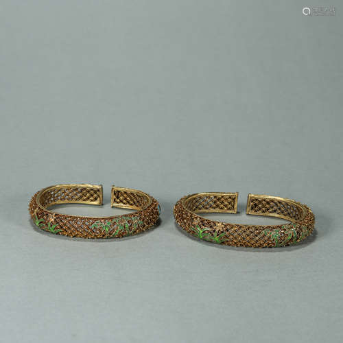 A pair of bamboo and orchid patterned gilding silver bracele...