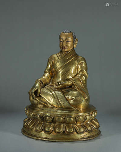 A gilding copper buddha statue