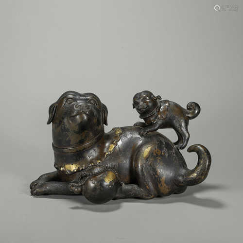 A gilt copper dog ornament