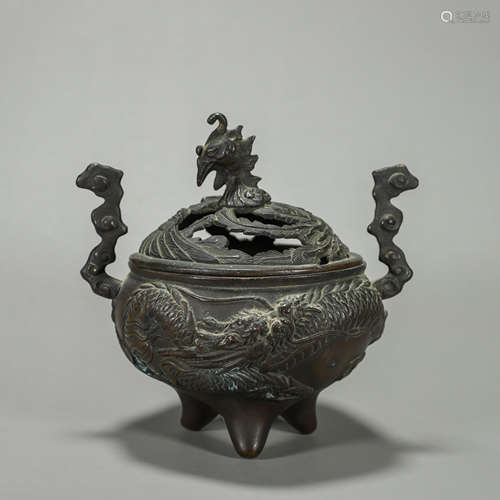 A dragon and phoenix patterned copper incense beurner with c...