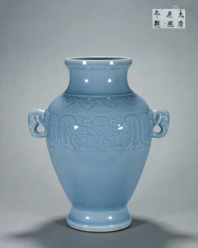 A taotie patterned celeste glazed porcelain zun with elephan...