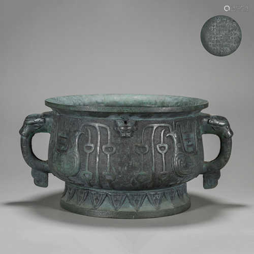 A phoenix bird patterned bronze pot with beast shaped ears