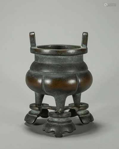 A double-eared three-legged copper censer