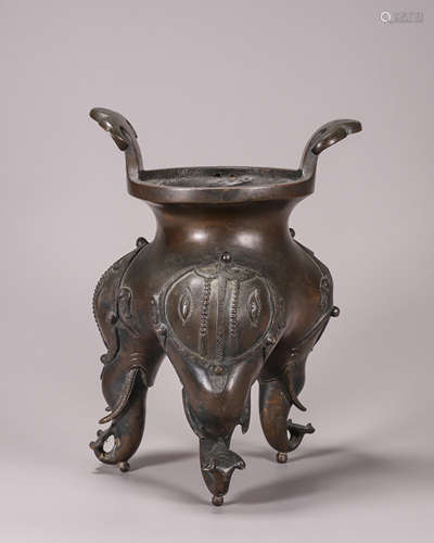 A gold sprinkled copper three-legged censer with ruyi shaped...