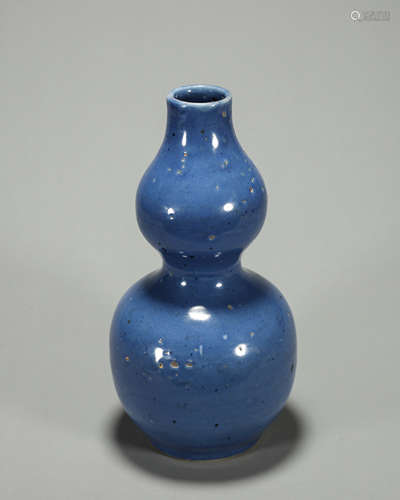 A blue glazed porcelain gourd-shaped vase